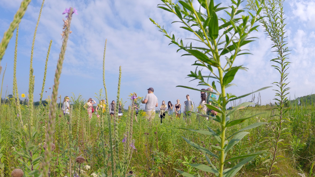 prairie wildflowers in foreground of group photo